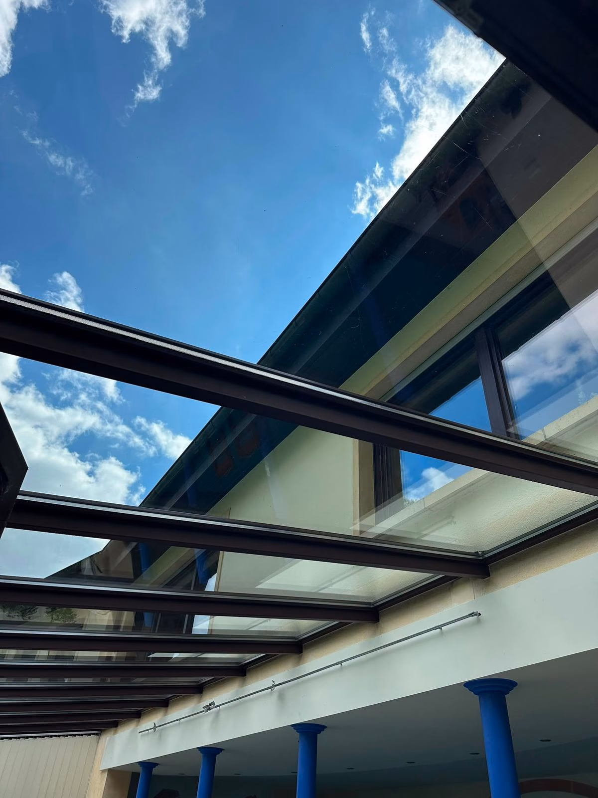 Clear, streak-free glass roof of a patio cover after window cleaning